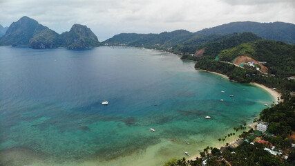 Aerial view of tropical beach with palm trees and islands