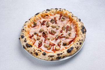 Pizza with ham, mushrooms and olives 
