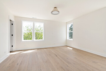 Contemporary Empty Room with Cream Walls and Custom Lighting for Virtual Staging. Bedroom with Windows and Pendant Light.