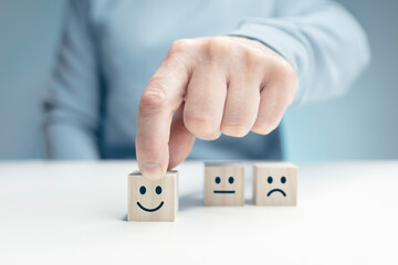 Customer service satisfaction and rating survey choosing a happy smiley emoji