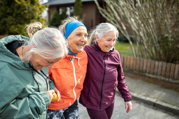 Active senior women exercising outside