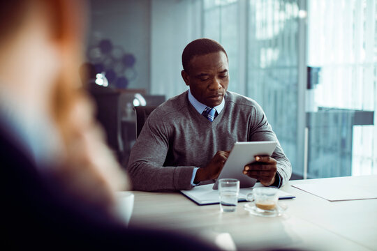 Businessman sitting in conference room meeting