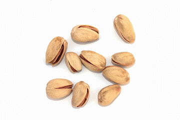 Pistachio nuts, pistachios close up. Isolated on a white background.