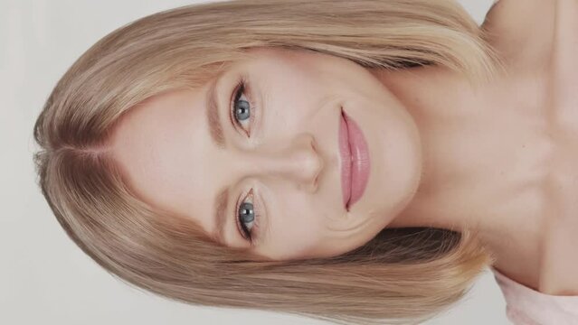 Studio portrait of young, beautiful and natural blond woman. Face lifting, cosmetics and make-up concept.