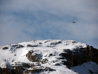 helicopter scenic tour on mountain winter dolomites snow panorama val badia valley