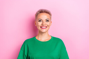 Portrait of cute cheerful girl beaming smile look up empty space fantasize isolated on pink color background