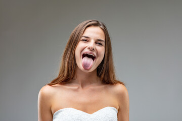 Spirited woman teases with a rebellious tongue