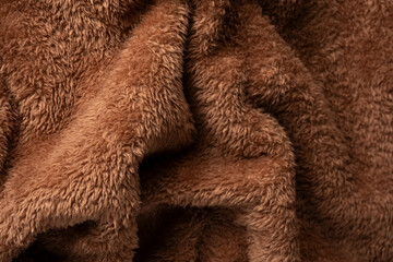 Texture of a brown faux fur as a background.