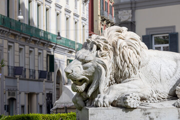 Stone lion statue at the base of the Monument to the Martyrs on Piazza dei Martiri, Naples, Italy