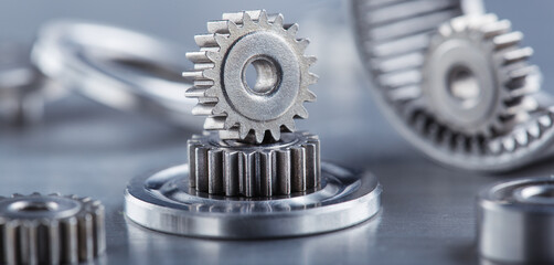 metal gears and bearings. Background with part of the mechanism.