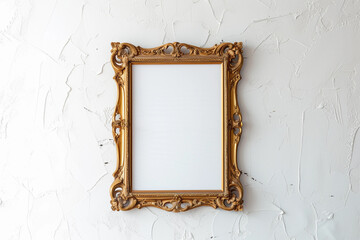 Vintage vertical gold frame hanging on white wall. Golden frame for mock up.