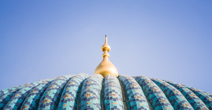 Blue domed roof of the Gur Emir mausoleum with mosaic in the ancient city of Samarkand in Uzbekistan, oriental architecture