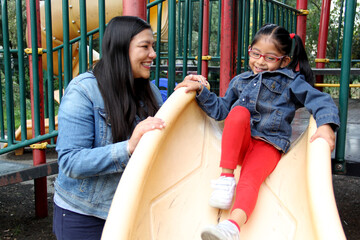 Divorced single mom and 4-year-old brunette Latina daughter spend quality time without technology...