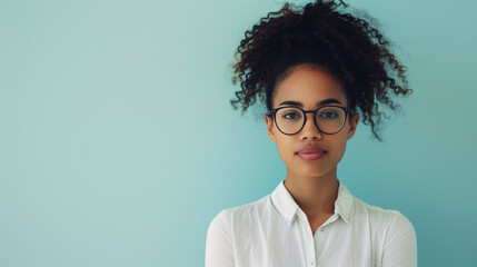 Young professional woman with curly hair wearing glasses