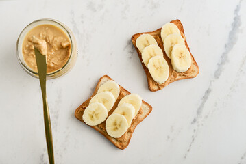 Peanut butter sandwich with fresh banana slices