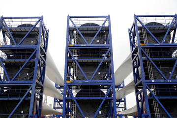 Newly constructed wings of wind-turbines ready to be transported to an offshore windpark, The Netherlands