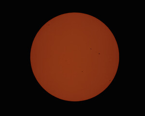 Midday photo of the sun with visible spots