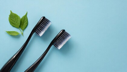 two toothbrushes on light blue background flat lay
