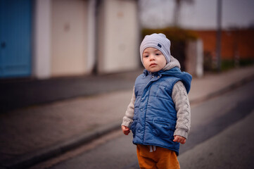 Toddler in Winter Attire Taking a Walk on a Chilly Day