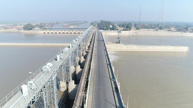 Aerial view of Head Taunsa Barrage is a barrage on the Indus River in Tehsil Taunsa, Dera Ghazi Khan District, Punjab Province, Pakistan. Where a lot of water is stored. Beautiful drone 4K view.