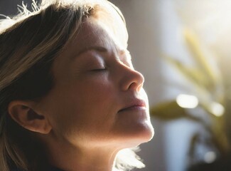 Serene Woman in Sunlit Room Practicing Mindfulness. A tranquil image woman with closed eyes, basking in sunlight, exuding peace and relaxation through breathwork or meditation.