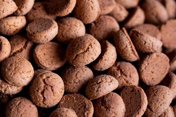 A tasty topdown portrait of a pile of delicious traditional dutch snacks called pepernoten or pepernuts. The gingerbread treat is a tradition during the holidays and sinterklaas or saint nicholas.