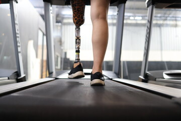 Disabled athletes practice exercise in the gym. Practice going up and down the different levels in...