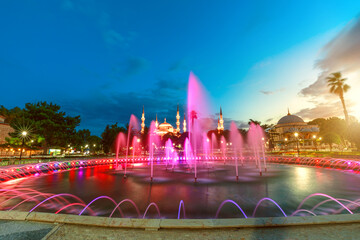 Night in Istanbul, Sultan Ahmet Park square is adorned with a beautiful fountain and surrounded by...
