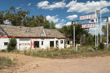 Deserted abandoned gas station, cafe, motel on old Historic Route 66 in western Tewxas USA. None descript generic signage.  - obrazy, fototapety, plakaty