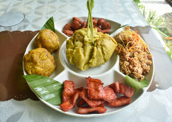 Amazonian round: Juanes, typical Amazonian food in banana leaves. Typical jungle food with rice, chicken and dresses. Peruvian food