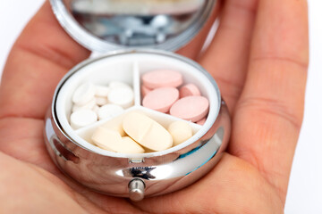 Pill box daily take a medicine in hand