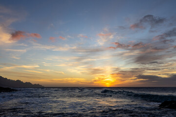 Sunset by the ocean and natural bathing pools of Agaete, Gran Canaria, Spain