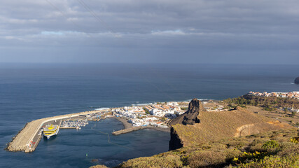 Town of Agaete and Puerto de las Nieves with ferry and port visible with sea background