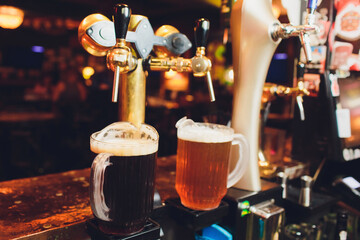 Close up of beer taps in row. Metallic equipment for bars and mini brewerys. Concept of modern...