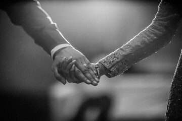 close up of hands holding each other