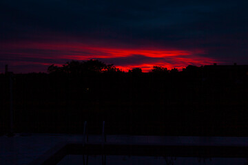 Red and dark dramatic sunset sky - 737529177