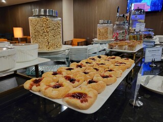 Jelly-topped Pastries on a Plate in an Airport Lounge