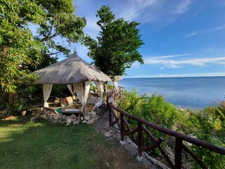 Beautiful tropical huts along the lush coast of San Juan - Siquijor, Philippines