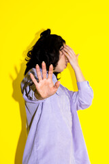 Distressed Woman Showing Stop Hand Sign