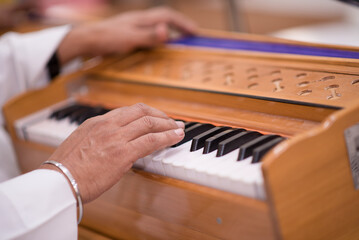 Fototapeta premium hands of a person playing the piano