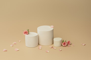 white podium on a beige background with roses, background for cosmetics