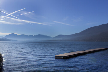 Water  and blue sky panoramic view Lake du Bourget Aix les bains town Auvergne-Rhône-Alpes region France - obrazy, fototapety, plakaty