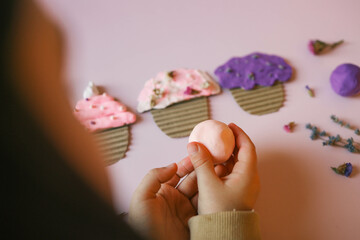 A child sculpts from plasticine, an idea for an activity