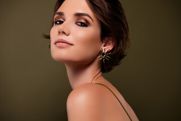 Close up photo of gorgeous chic girlfriend look have glamour makeover wear golden jewel over green...