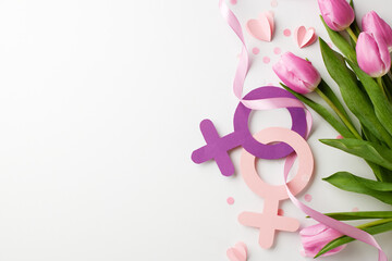 Soft yet strong: the tender might of womanhood. Top view shot of pink tulips, a flowing ribbon, and...