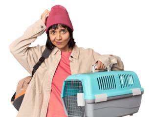 Young Hispanic woman ready for travel with pet carrier showing number two with fingers.