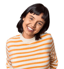 Young Hispanic woman with short black hair in studio happy, smiling and cheerful.