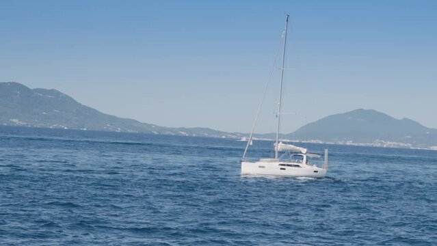 White yacht ship boats with a sail on regata voyage trip in the blue sea