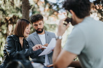 Diverse business team discussing strategies for growth, budget management, and sales. Entrepreneurs in urban area analyzing investments and planning for success.