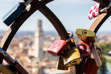 Love locks fixed to the railings on the top of Colle San Pietro (Saint Peter's Hill) and Verona...